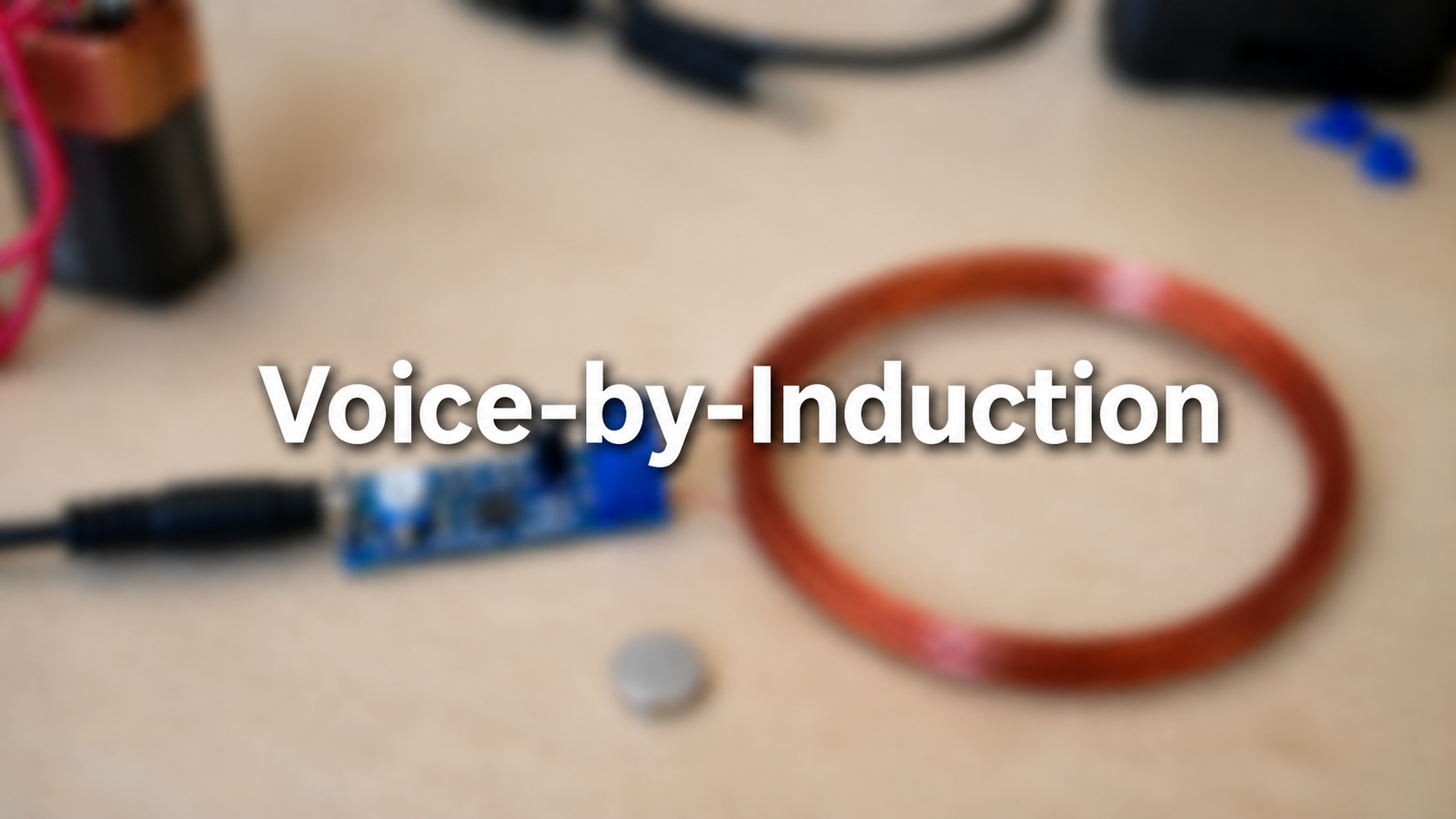 Voice-by-Induction title slide over a blurred hardware workbench with a small blue amplifier board, copper wire, and electronics parts